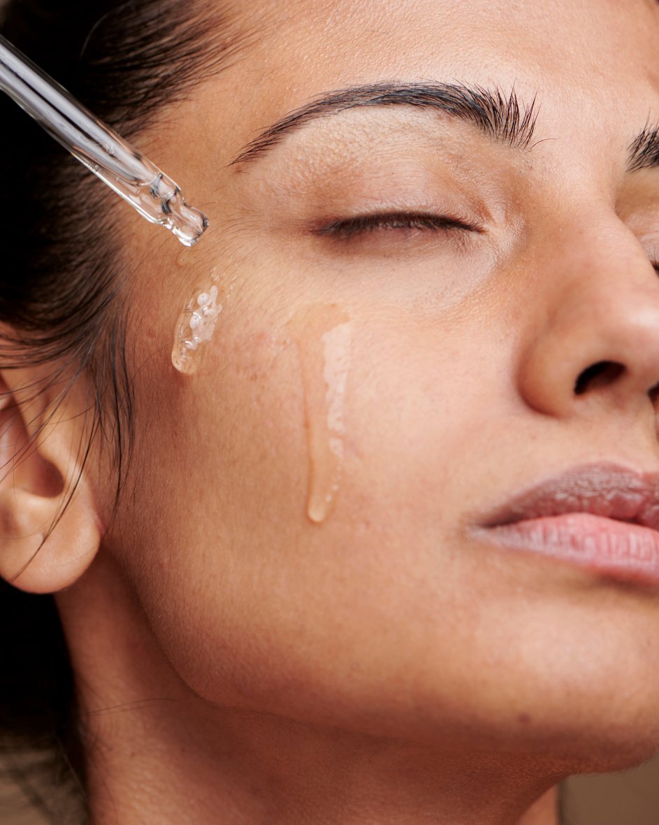 Woman Applying Serum on Face